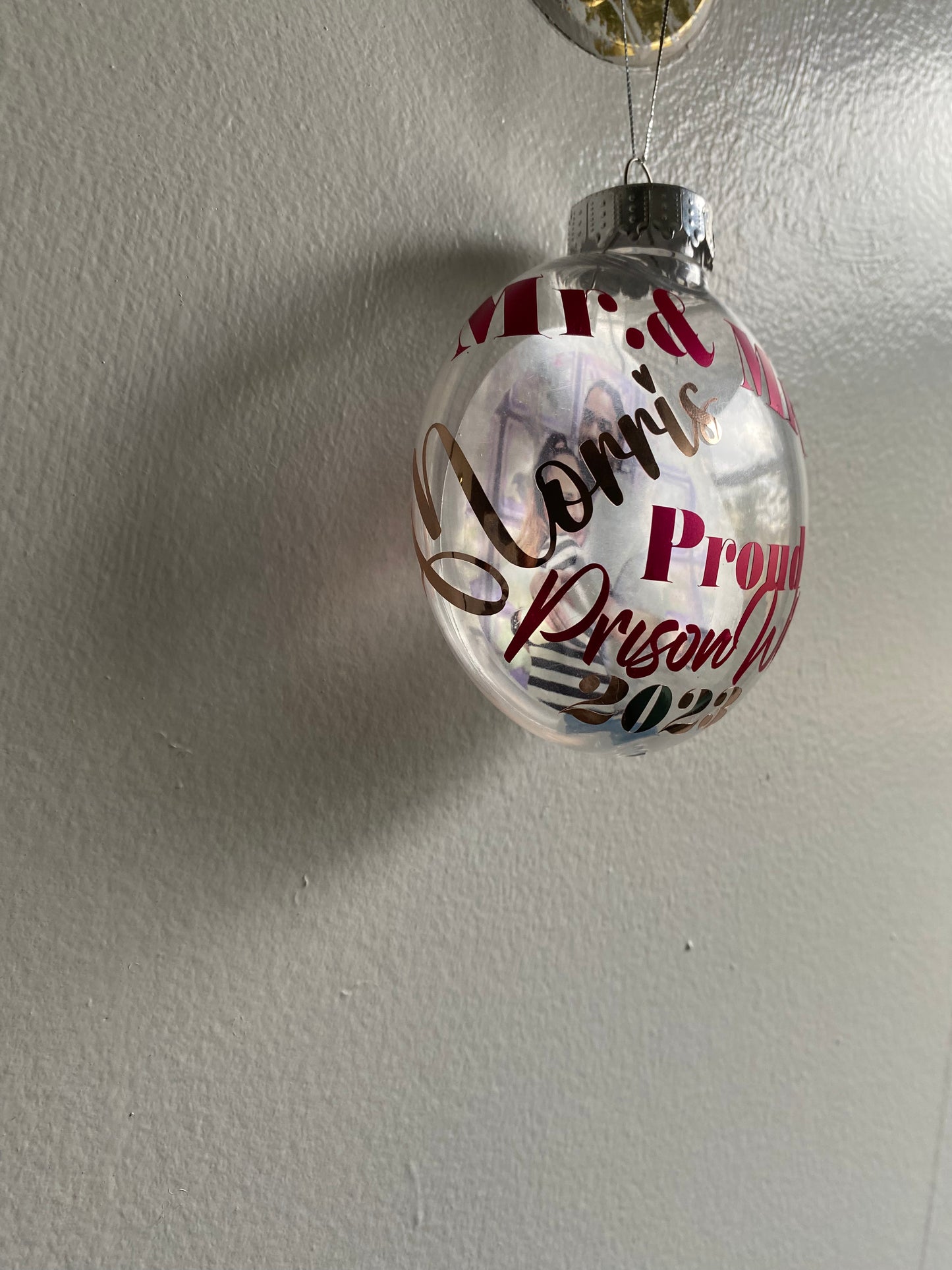 Proud prison wife floating ornaments. Customizable to add Mr.and Mrs. With last name, , special saying , favorite phrase, and year or date. Different colored lettering available.